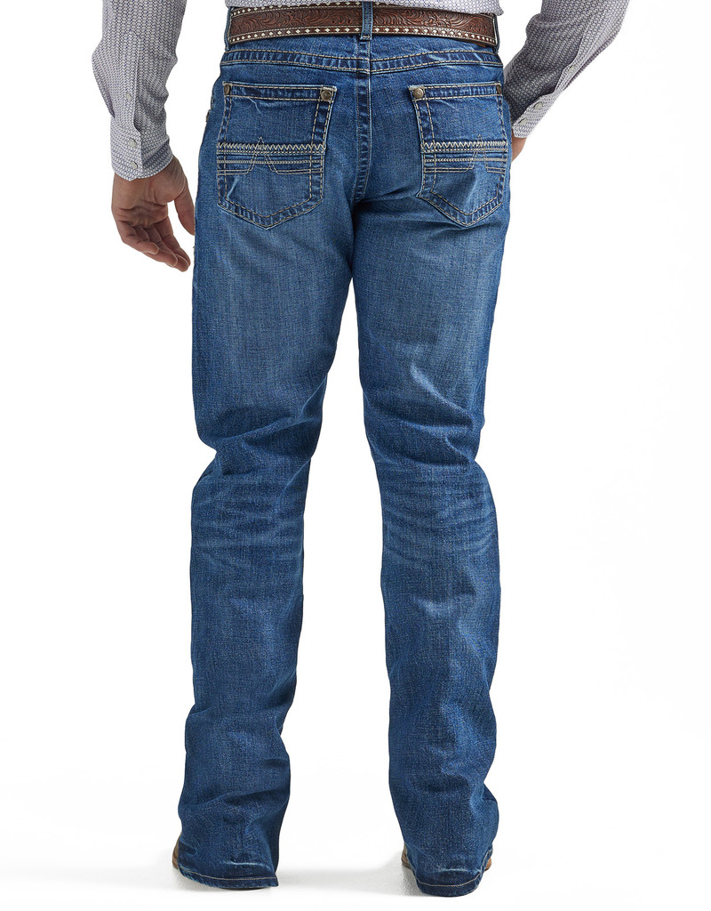 Men s Wrangler Rock 47 Medium Wash Slim Boot Cut Jean Oklahoma s Premier Western Clothing Store